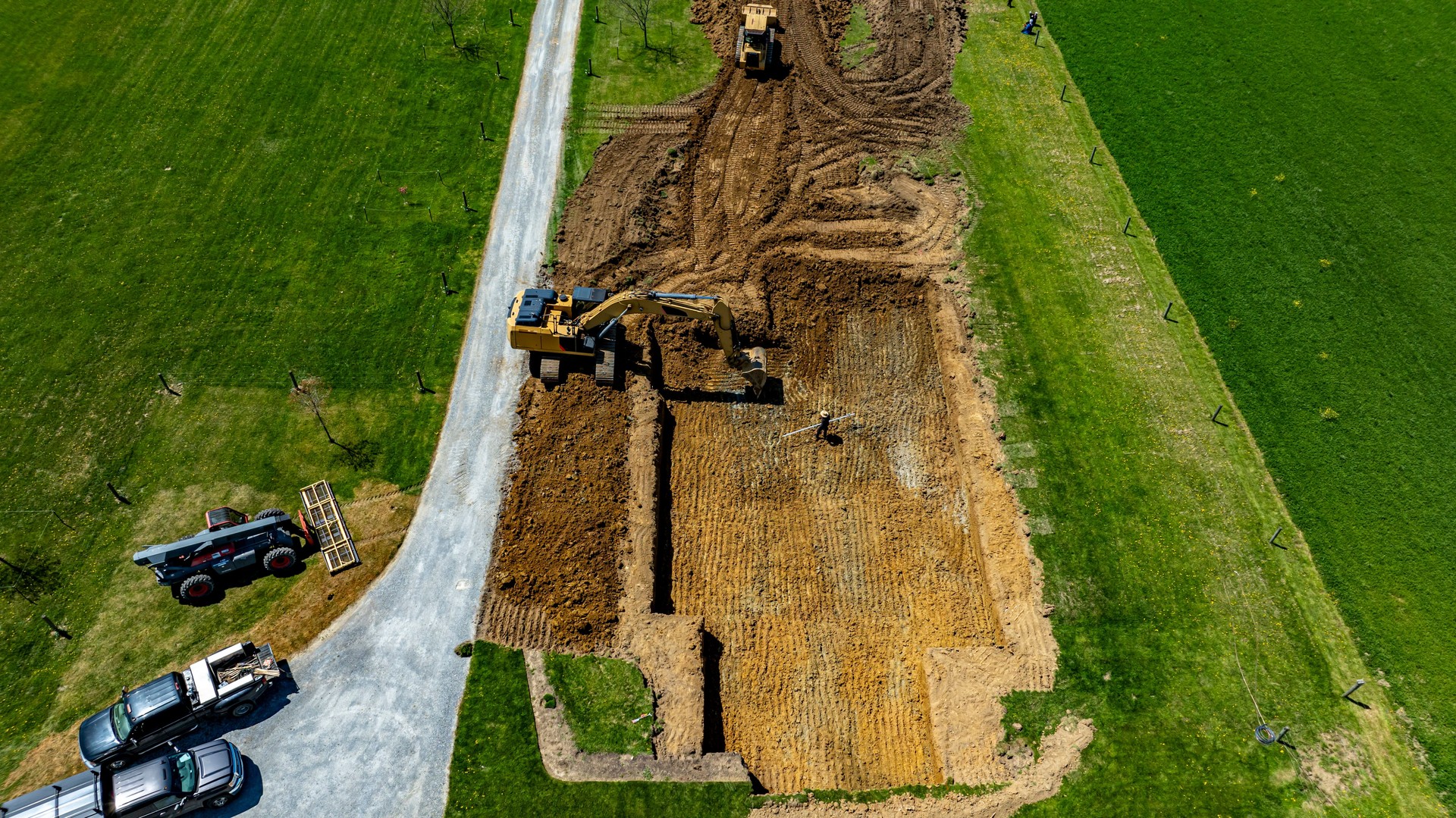 Construction Site Showing Excavation for a New Foundation in a Residential Area During Daytime